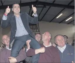 ??  ?? John Paul O'Shea and family and friends celebratin­g his great results in the local election at the count in Mallow Youth Centre last Saturday.