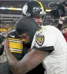  ?? Matt Freed/Post-Gazette ?? Ben Roethlisbe­rger and Lamar Jackson embrace after the game.