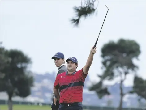  ?? ASSOCIATED PRESS ?? PATRICK REED (right) signals for an official in front of Carlos Ortiz of Mexico on the 16th hole on the South Course during the final round of the Farmers Insurance Open tournament at Torrey Pines on Sunday in San Diego.