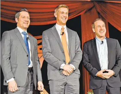  ?? AMY DAVIS/BALTIMORE SUN ?? Orioles managing partners Louis Angelos, left, and his brother John Angelos, right, introduce Mike Elias, whom they selected as the club’s new general manager.