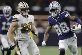  ?? BRETT DUKE — THE ASSOCIATED PRESS ?? Cowboys wide receiver CeeDee Lamb (88) runs past Saints linebacker Pete Werner (20) during the first half on Thursday in New Orleans.