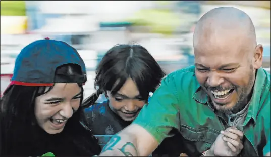  ?? Sundance Institute ?? Puerto Rican rap singer Residente, right, is featured in this scene from 2024 Sundance Film Festival winner “In the Summers.”