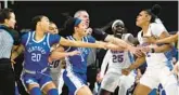  ?? MIC SMITH/AP ?? Florida’s Tatyana Wyche, right, is held by teammate Faith Dut and others during a scuffle with Kentucky players during the first half of a 72-57 loss in the SEC women’s tournament Wednesday in Greenville, S.C.