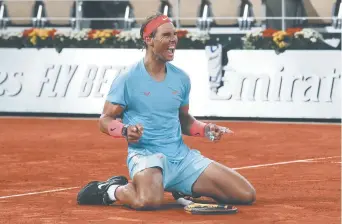  ??  ?? Rafael Nadal a dominé Novak Djokovic en trois manches de 6-0, 6-2, 7-5 en finale des Internatio­naux de France. - Associated Press: Michel Euler