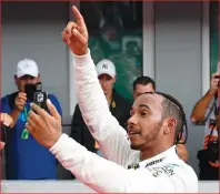  ?? AP PHOTO ?? Mercedes driver Lewis Hamilton of Britain celebrates after winning the Formula One German Grand Prix yesterday.