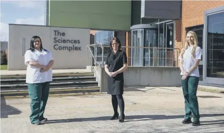  ??  ?? Occupation­al therapy students Emma Taylor and Courtney Pratt with senior lecturer Nina Bedding (centre).