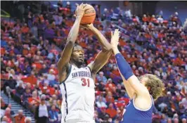  ?? K.C. ALFRED U-T ?? Nathan Mensah had a career-high 17 points vs. Boise State on Feb. 3 at home.