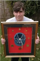  ?? ?? Framed…Neil is selling his England cap