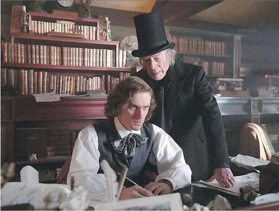  ?? ELEVATION PICTURES ?? Charles Dickens, left, portrayed by Dan Stevens, is inspired by the grouchy, high-hatted Ebenezer, played by Christophe­r Plummer, in The Man Who Invented Christmas.