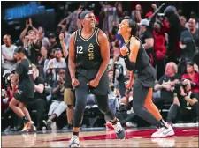  ?? CHASE STEVENS/LAS VEGAS REVIEW-JOURNAL/AP PHOTO ?? Las Vegas Aces guard Chelsea Gray (12) and forward A’ja Wilson celebrate after a play against the Minnesota Lynx during the second half of a WNBA game on Sunday in Las Vegas.