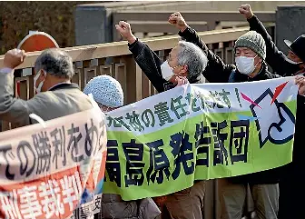  ?? AP ?? Protesters outside the Tokyo High Court in Tokyo this week after the court found three former executives of Tokyo Electric Power Company not guilty of negligence over the 2011 Fukushima nuclear meltdowns and subsequent deaths of more than 40 elderly residents during their forced evacuation. The Japanese government plans to release treated radioactiv­e water from the wrecked Fukushima nuclear plant into the sea.