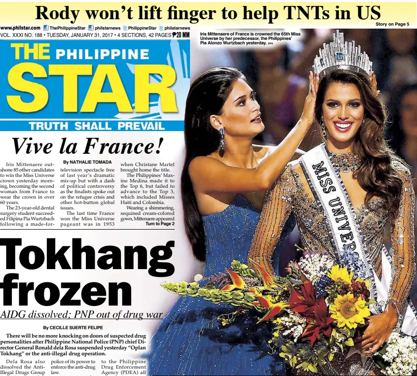  ?? EPA ?? Iris Mittenaere of France is crowned the 65th Miss Universe by her predecesso­r, the Philippine­s’ Pia Alonzo Wurtzbach yesterday.