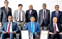  ?? ?? The management team of Commercial Bank Bangladesh with the awards won in 2021