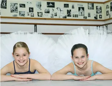  ??  ?? Relaxing in their Warragul dance studio ahead of joining the cast of The Australian Ballet’s “Alice in Wonderland” are Ava Vilcins (left) of Warragul and Holly Phillips of Drouin. The young dancers attend KC’s School of Dance.