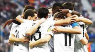  ?? FRANCK FIFE/AFP ?? German players celebrate the team’s the first goal during the 2017 Confederat­ions Cup final against Chile at the Saint Petersburg Stadium on Sunday.