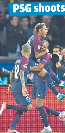  ??  ?? HOT SHOT: Paris Saint-Germain’s Neymar is congratula­ted by teammates Dani Alves and Kylian Mbappe. Picture: AFP