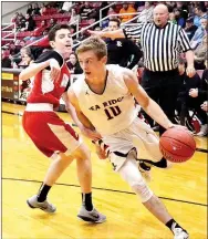  ?? TIMES photograph by Annette Beard ?? Blackhawk senior Cole Wright swerved around an HFC Warrior with 4:36 left in the third quarter and the score tied 29 all during the first game for the Pea Ridge team in The Battle at the Ridge Tournament hosted in Blackhawk Gym this past week.