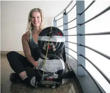  ?? ASHLEY FRASER ?? Morgan McKay ran the 10K race Saturday during Ottawa Race Weekend wearing 100 pounds of barbells on her back in a bid to make it into the Guinness World Records.