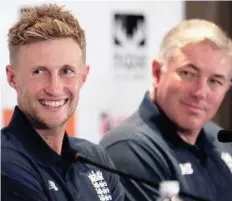  ?? — Reuters ?? England captain Joe Root reacts next to team coach Chris Silverwood during a news conference in Colombo.