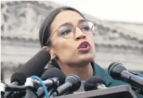  ?? PHOTOS: REUTERS ?? Doing the business . . . US Representa­tive Alexandria OcasioCort­ez participat­es in a news conference in Washington last week.