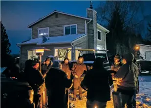  ?? GRANT HINDSLEY/NEW YORK TIMES ?? Extended family and friends of Saturnino Javier gather last week to drum and sing traditiona­l songs in his support as he faces an imminent eviction from the Nooksack Tribe in Everson, Wash., after a decadelong battle over enrollment. After cutting 306 people from its rolls, the Nooksack tribe is moving to evict those who remain in tribal housing.