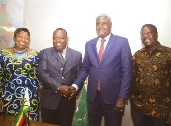  ??  ?? Foreign Affairs and Internatio­nal Trade Minister Retired Lieutenant-General Sibusiso Moyo (second from left) and African Union Commission Chairman Moussa Faki Mahamat (second from right) pose for a photo with AU Commission­er Political Affairs Minata...