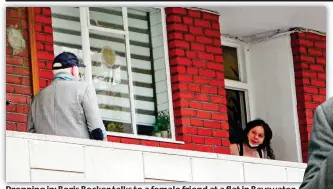  ?? ?? Dropping in: Boris Becker talks to a female friend at a flat in Bayswater