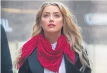  ??  ?? Amber Heard arriving at the High Court in July 2020