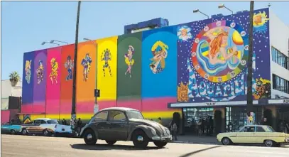  ?? Andrew Cooper Sony Pictures ?? THE MURAL on the Aquarius Theater on Sunset Boulevard was re-created to shoot “Once Upon a Time in Hollywood.”