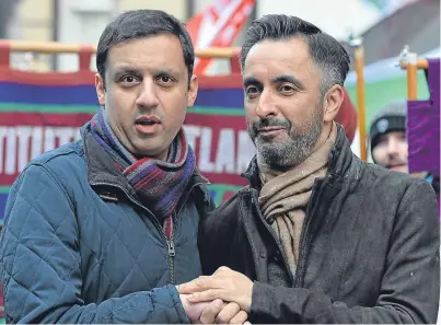  ?? Picture: PA. ?? Lawyer Aamer Anwar, right, and Labour MSP Anas Sarwar took part in an anti-racism rally in Glasgow at the weekend. It was organised by Stand up to Racism Scotland.