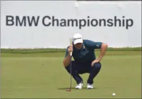  ?? PETE BANNAN — DIGITAL FIRST MEDIA ?? Justin Rose sizes up his putt on the 18th hole at Aronimink Golf Club Friday during the BMW Championsh­ip.