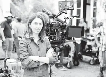  ?? — Photos courtesy of Focus Features ?? Screenwrit­er and director Coppola on the set of ‘The Beguiled’. (Below) Kidman as Miss Martha and Farrell as John McBurney in ‘The Beguiled’.