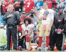  ?? ASSOCIATED PRESS FILE PHOTO ?? San Francisco 49ers quarterbac­k Colin Kaepernick kneels during the national anthem before an NFL game against Buffalo in 2016.