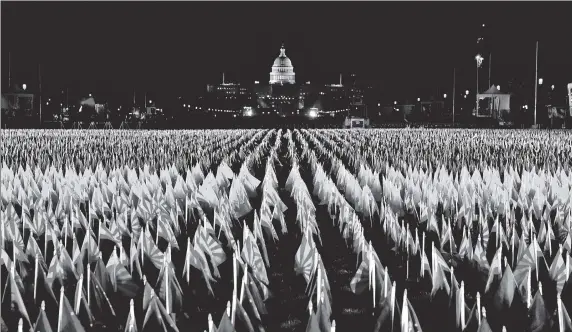  ?? AFP ?? Nearly 200,000 flags are on display at the National Mall in Washington, DC ahead of Joe Biden’s inaugurati­on as the US president. The presentati­on, known as ‘Field of Flags’, represents the American people who are unable to travel to the US capital for Biden’s oath ceremony due to Covid-19 curbs and security threats.