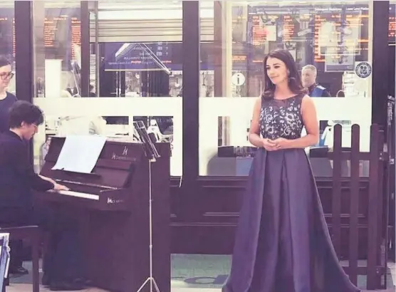  ??  ?? Motherwell soprano Monica McGhee helped launch charity Stand UpTo Cancer’s annual campaign with a performanc­e at Glasgow Central Station.
The opera singer won her own battle with cancer, after being diagnosed with thyroid cancer at just 28.
After fearing the illness would mean she would never sing again, she has battled back and is now able to perform on stage again.
Now, she is hoping to inspire others as the 31-yearold launched her latest charity campaign with a spontaneou­s show.
Monica took toTwitter following the performanc­e. She said: “It was such an honour to help launch Stand UpTo Cancer today with Cancer Research by bringing opera to Glasgow Central Station.”
She later added:“Huge love and thanks to everyone for their support.”