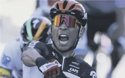  ??  ?? 0 Australia’s Caleb Ewan roars with delight as he crosses the finish line to win the third stage of the Tour de France in Sisteron.