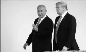  ??  ?? In this March 25 file photo, President Donald Trump and visiting Israeli Prime Minister Benjamin Netanyahu walk along the Colonnade of the White House in Washington.
AP PhoTo/MAnuel BAlce ceneTA