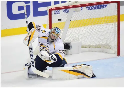  ??  ?? Goaltender Pekka Rinne of the Nashville Predators takes a shot off his mask which goes into the net on a wristshot by Nick Ritchie (37) of the Anaheim Ducks (not in photo) in the second period of Game 2 of the Western Conference Final during the 2017...