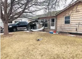  ?? BROOMFIELD POLICE DEPARTMENT ?? Debris is scattered in the front yard of a house on Saturday in Broomfield, Colorado.