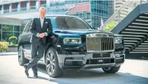  ??  ?? Torsten Müller-Ötvös, chief executive officer, Rolls-Royce Motor Cars with Rolls-Royce Cullinan