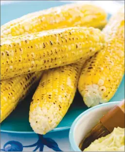  ?? The Associated Press ?? This grilled corn on the cob recipe appears in The Complete Cook’s Country TV Cookbook, 2017.