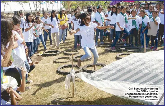  ?? CESAR RAMIREZ ?? Girl Scouts play during
the 30th citywide encampment in Lingayen,
Pangasinan yesterday.