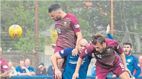  ?? Picture: PPA. ?? Tony Watt rises above the Montrose defence to head home St Johnstone’s winning goal.