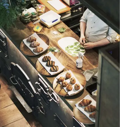  ??  ?? Left Food being prepared for service at Hide’s ground-floor restaurant, Ground