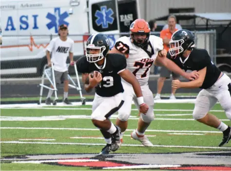  ?? (Pine Bluff Commercial/I.C. Murrell) ?? White Hall quarterbac­k Matthew Martinez finds open running room as Warren defensive lineman Hunter White gives chase in the first quarter Friday night in White Hall.