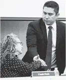  ?? Tom Reel / Staff photograph­er ?? South San ISD board President Connie Prado shakes hands with Alexandro Flores earlier this month just before buying out his contract as superinten­dent, one of many questionab­le recent moves at the district. It’s time to discuss consolidat­ing some of our troubled school districts.