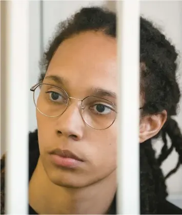  ?? ALEXANDER ZEMLIANICH­ENKO/AP ?? WNBA star and two-time Olympic gold medalist Brittney Griner sits in a cage at a court room prior to a hearing on July 27 in Khimki, just outside Moscow, Russia.