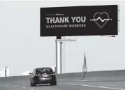  ?? NAM Y. HUH AP ?? A billboard on I-55 in Chicago displays a thank-you message to healthcare workers who are working to help patients during the coronaviru­s pandemic.