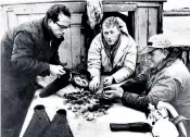  ??  ?? Storm (left) in 1965 with fellow divers and coins from Le Chameau