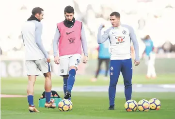  ??  ?? Chelsea’s Eden Hazard (right), Davide Zappacosta and Alvaro Morata warm up before the match at London Stadium in London, Britain in this Dec 9 file photo. — Reuters photo